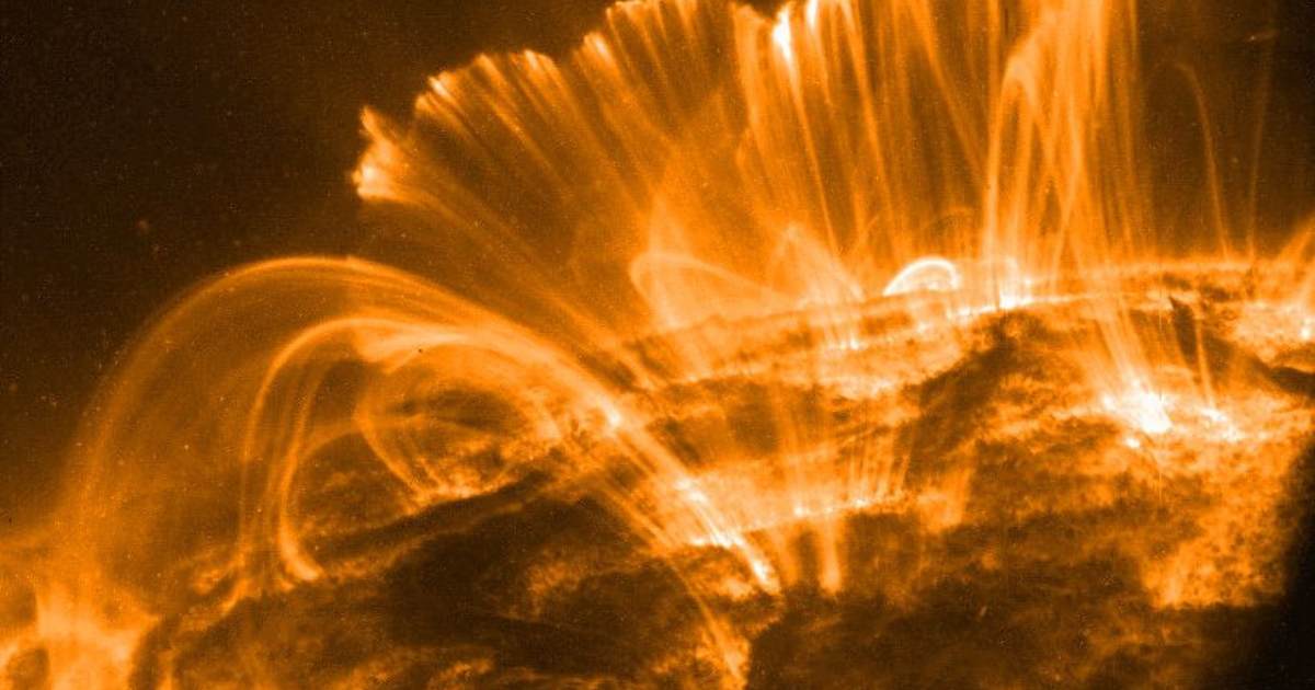 In this picture, the Sun's surface is is seen with coronal loops lofted over a solar active region by magnetic fields. (Representative Cover Image Source: NASA | GSFC | TRACE)
