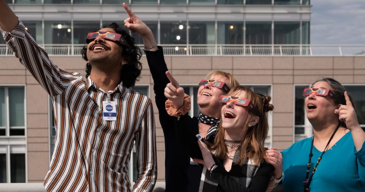 Observers pointing toward the Sun as they watch a solar eclipse wearing special protective glasses. (Cover Image Source: NASA)