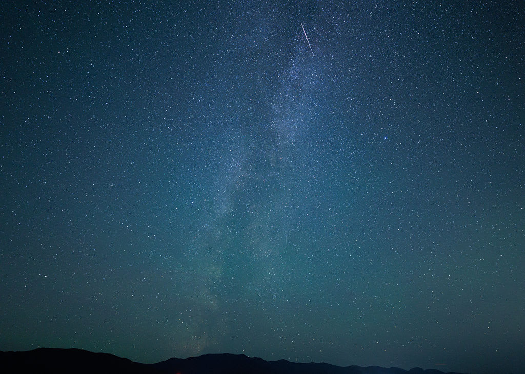 A meteor streaks across the Milky Way during the Perseid meteor shower peak on August 13, 2026 in Deep Bay, Vancouver Island, British Columbia, Canada.