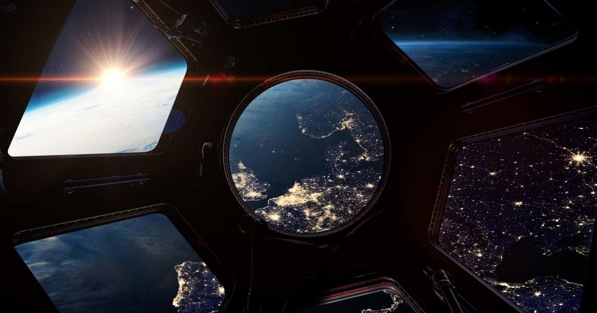 A view of a portion of planet Earth from space, through a window on the International Space Station (Representative Cover Image Source: Buradaki | Getty Images)