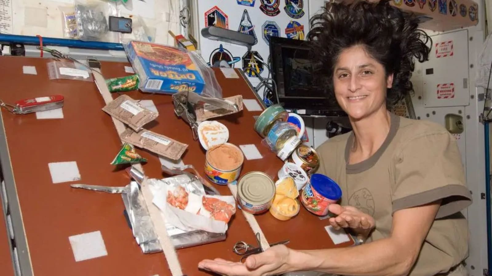 Former NASA astronaut Sunita Williams displays her meal aboard the International Space Station.