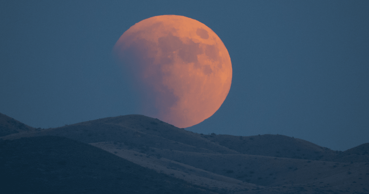 Super-blood moon rises over the Dragoon Mountains as viewed from Tombstone, Arizona — CochiseVista/Getty Images