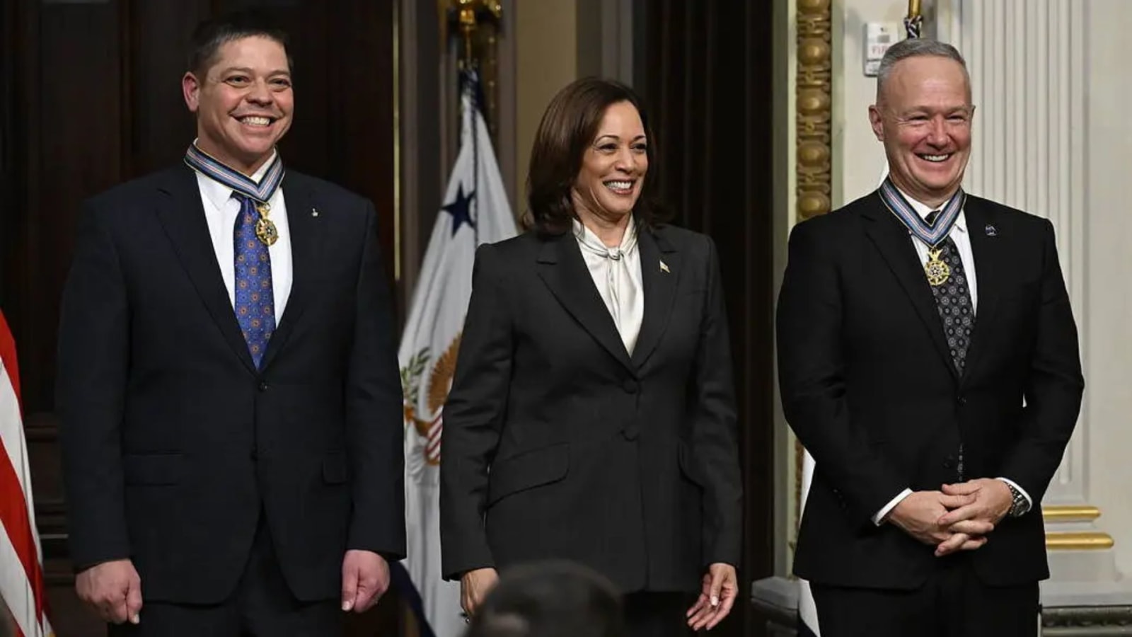Former NASA astronauts Robert Behnken, left, and Douglas Hurley, right, are seen after being awarded the Congressional Space Medal of Honor by Vice President Kamala Harris, Jan 31, 2023.