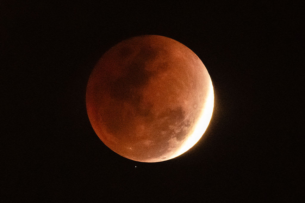 A total lunar eclipse transitions into the partial phase as sunlight begins to reappear on the lunar surface on March 3, 2026 in Sanya, Hainan Province, China
