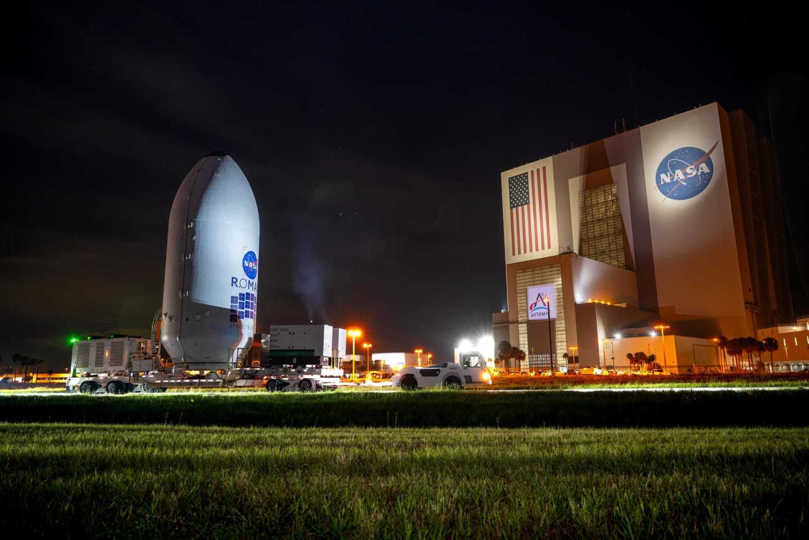 NASA’s Nancy Grace Roman Space Telescope, encapsulated in its payload fairing, travels to the SpaceX hangar at Launch Complex 39A at NASA’s Kennedy Space Center on Aug. 25, 2026.