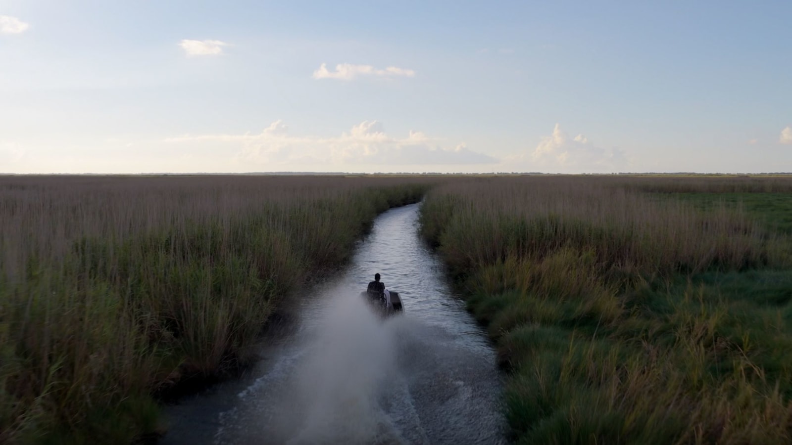 A boat wades through the marshland in Louisiana at the site of SpaceX's upcoming city Starbase.