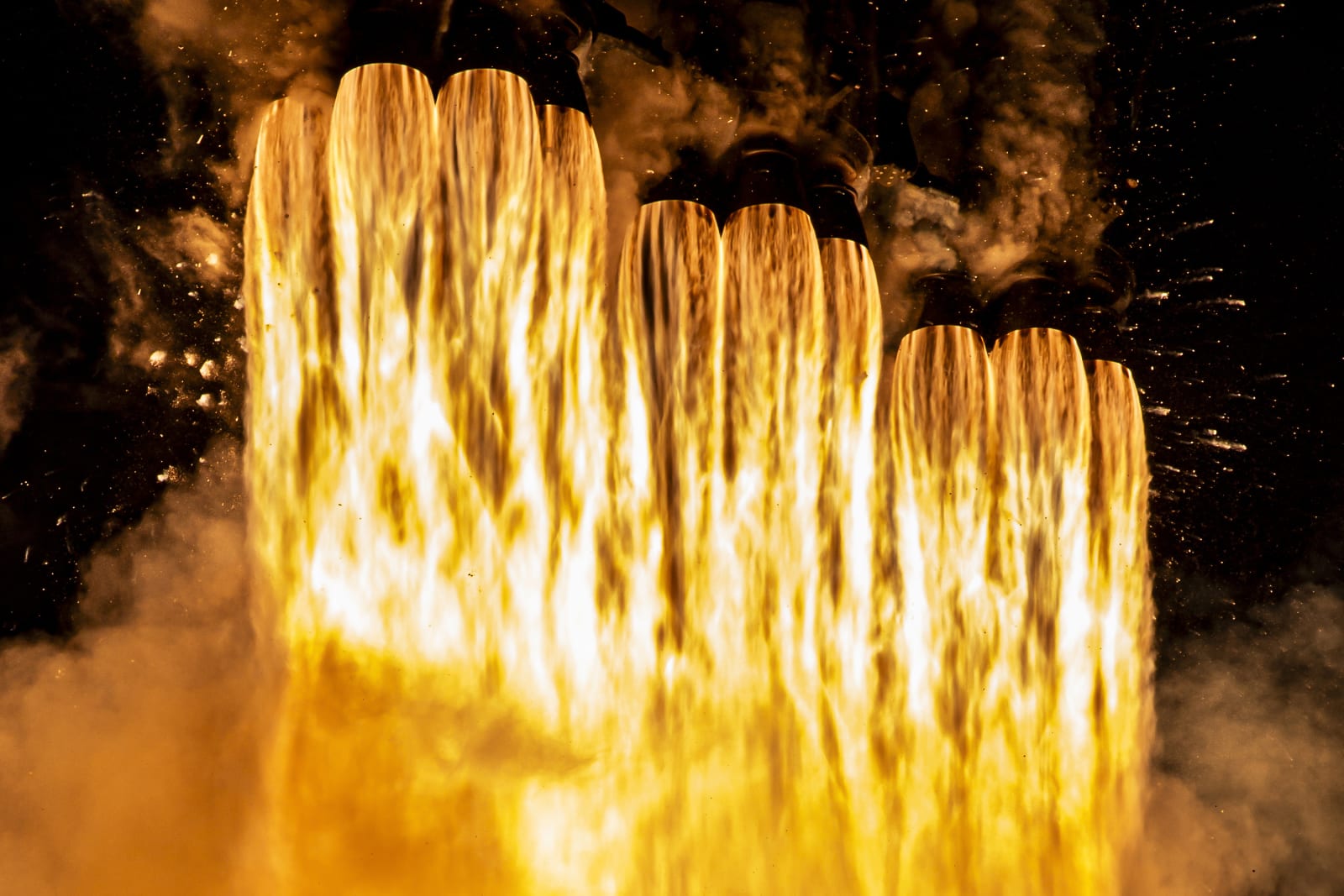 The Falcon Heavy boosters generating more than 5 million pounds of thrust.