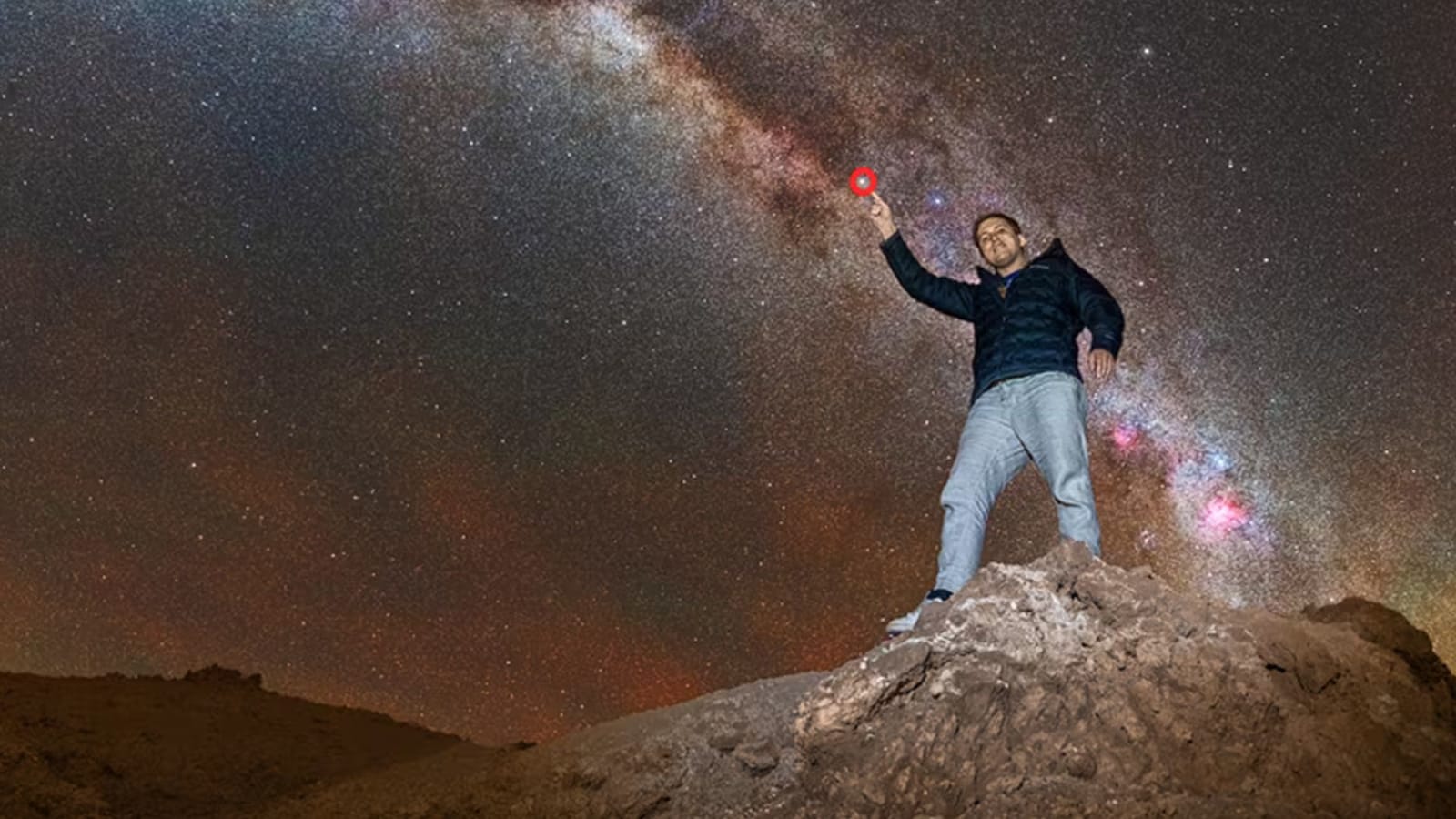 Philip Johnston, pointing at the exact star Alpha Centauri - the target of the mission. The red circle is where the spacecraft will fly toward aiming to be within 1% of the distance at closest pass
