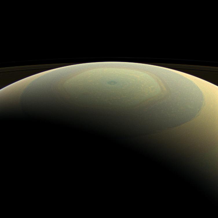The globe of Saturn, seen here in natural color, is reminiscent of a holiday ornament in this wide-angle view from NASA's Cassini spacecraft. The characteristic hexagonal shape of Saturn's northern jet stream appears somewhat yellow here. At the pole lies a Saturnian version of a high-speed hurricane, eye and all. Images taken using red, green and blue filters were combined to create this natural-color view, taken with the Cassini spacecraft wide-angle camera on July 22, 2013, at a distance of approximately 611,000 miles (984,000 kilometers) from Saturn.