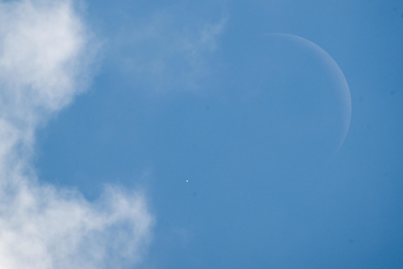 Venus is seen as it disappears behind the Moon at the start of the occultation on June 17, 2026, from the Mary W. Jackson NASA Headquarters building in Washington
