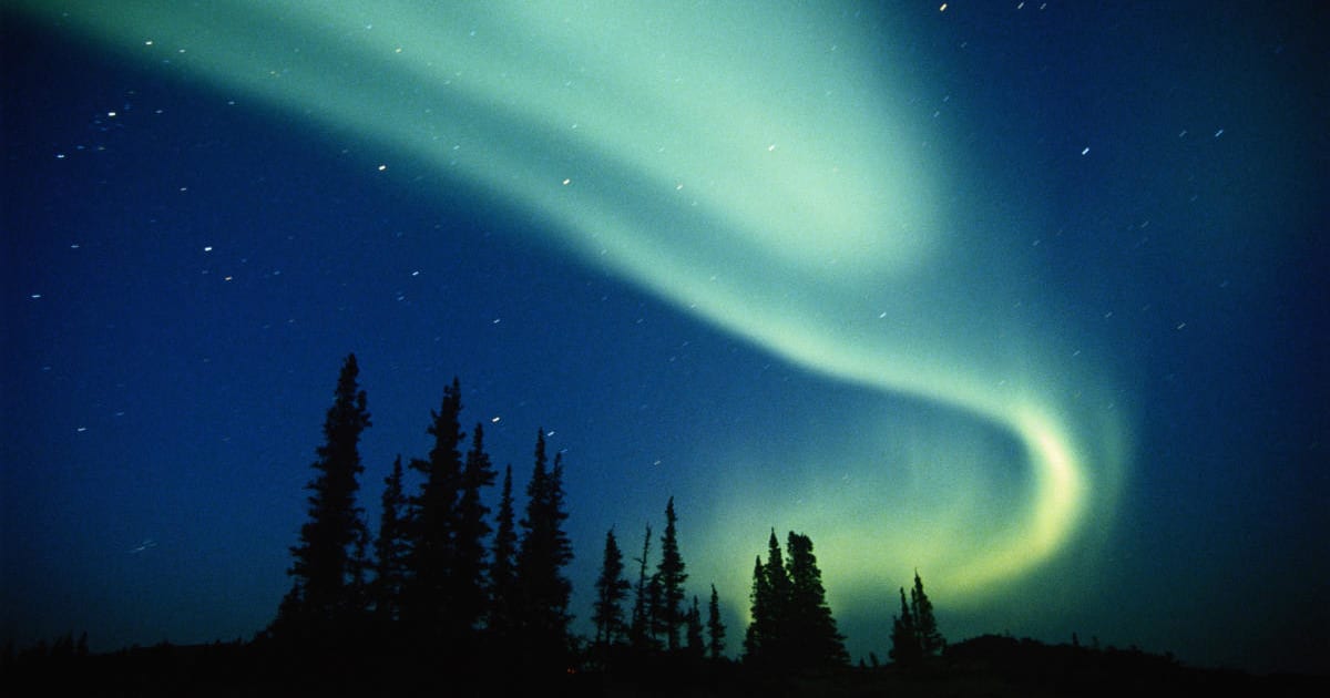 Image of aurora borealis (Northern Lights), in Northwest Territories, Canada (Cover Image Source: Getty Images | George Lepp)