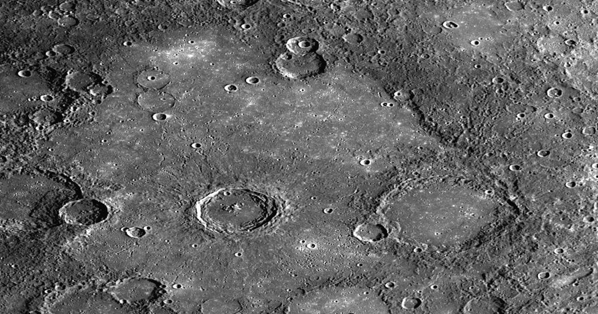 Volcanic plains surrounding Rudaki crater on Mercury, where ancient lava flows flooded older craters and left their rims partially preserved.  (Image Source: NASA/Johns Hopkins University Applied Physics Laboratory/Carnegie Institution of Washington)