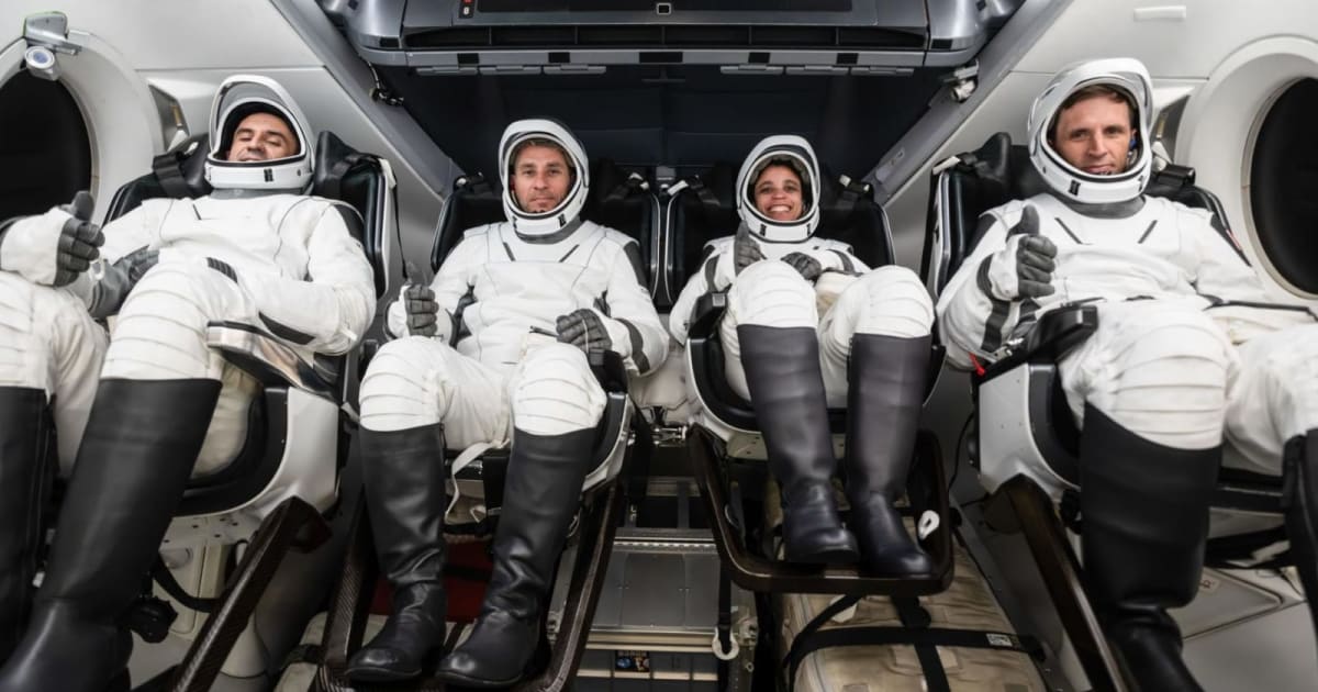 From left are Sergey Teteryatnikov, Luke Delaney, Jessica Watkins, and Joshua Kutryk inside a mockup Dragon spacecraft. — (Cover Image Source: SpaceX)
