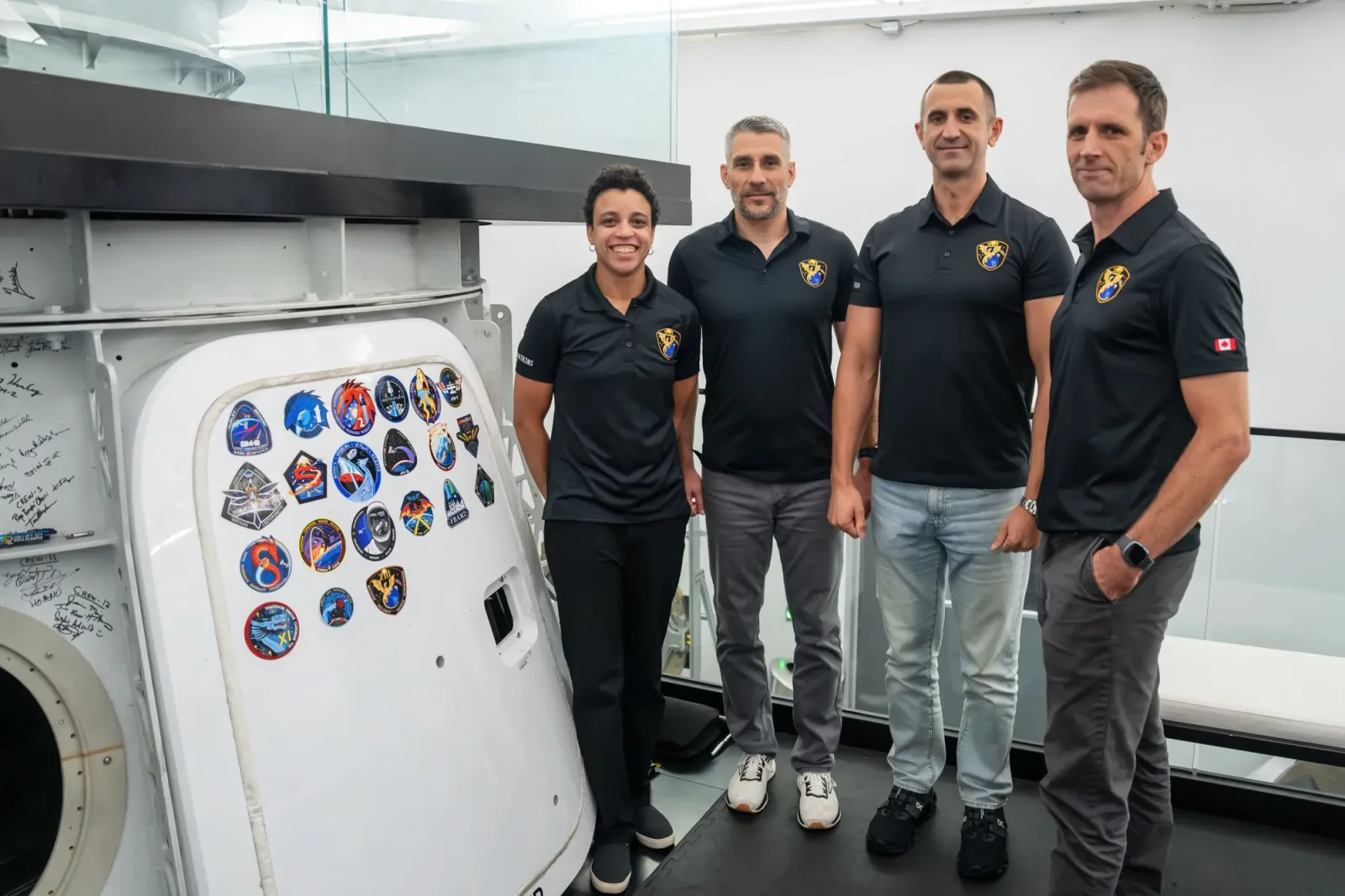 The four members representing NASA’s SpaceX Crew-13 mission to the International Space Station pose for a portrait next to the Dragon spacecraft mockup after completing a preflight training session at SpaceX’s facility in Hawthorne, California.