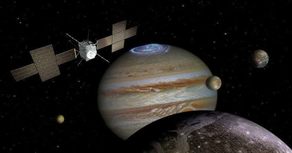 An illustration shows ESA’s JUICE spacecraft approaching Jupiter and its icy moons. (Image Source: NASA/ESA)