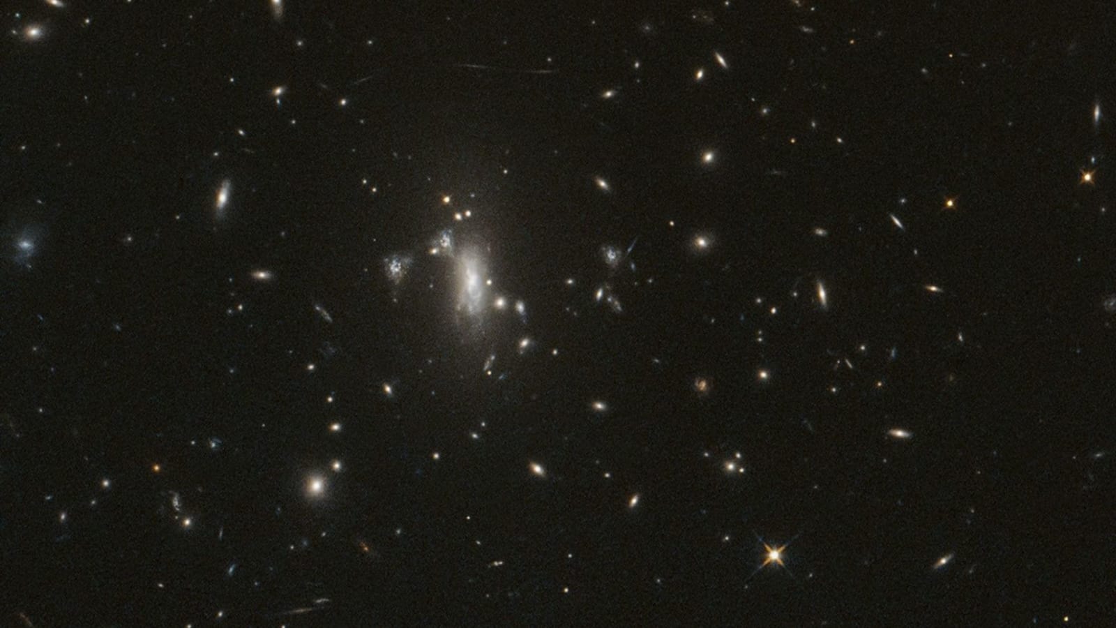 The galaxy cluster MACS J0417 (left center of the image) will act a magnifying lens in observations of Supernova Athena.