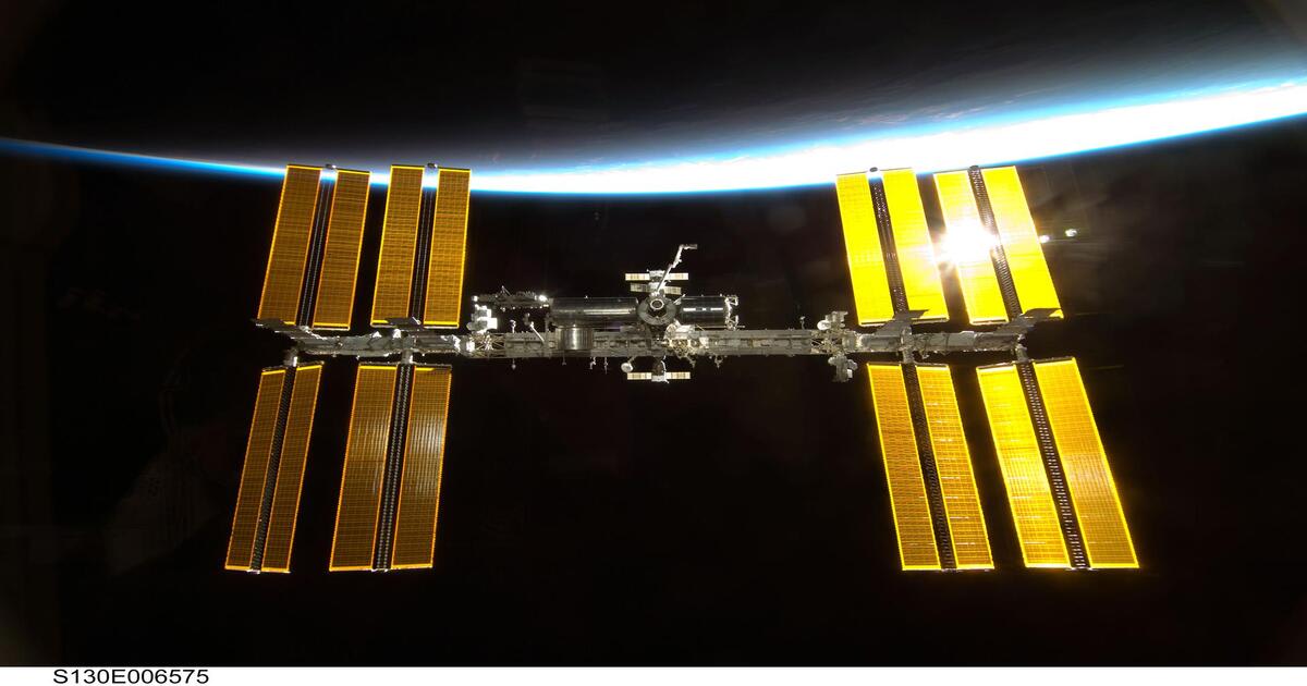 An astronaut photograph shows the International Space Station against the backdrop of Earth during the Space Shuttle Endeavour’s approach in 2010.  (Image Source: NASA)
