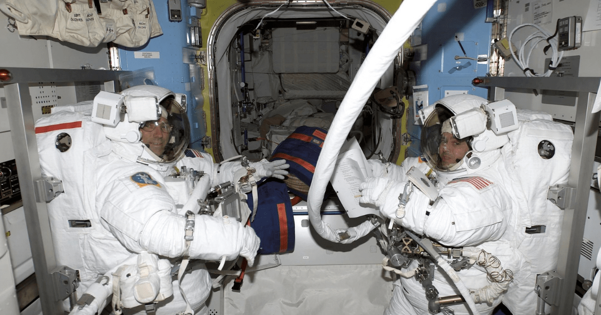 Astronauts Carl E. Walz (left) and Daniel W. Bursch of Expedition 4 undergo prebreathing exercise in the Quest Airlock before a spacewalk. (Representative Image Source: NASA)