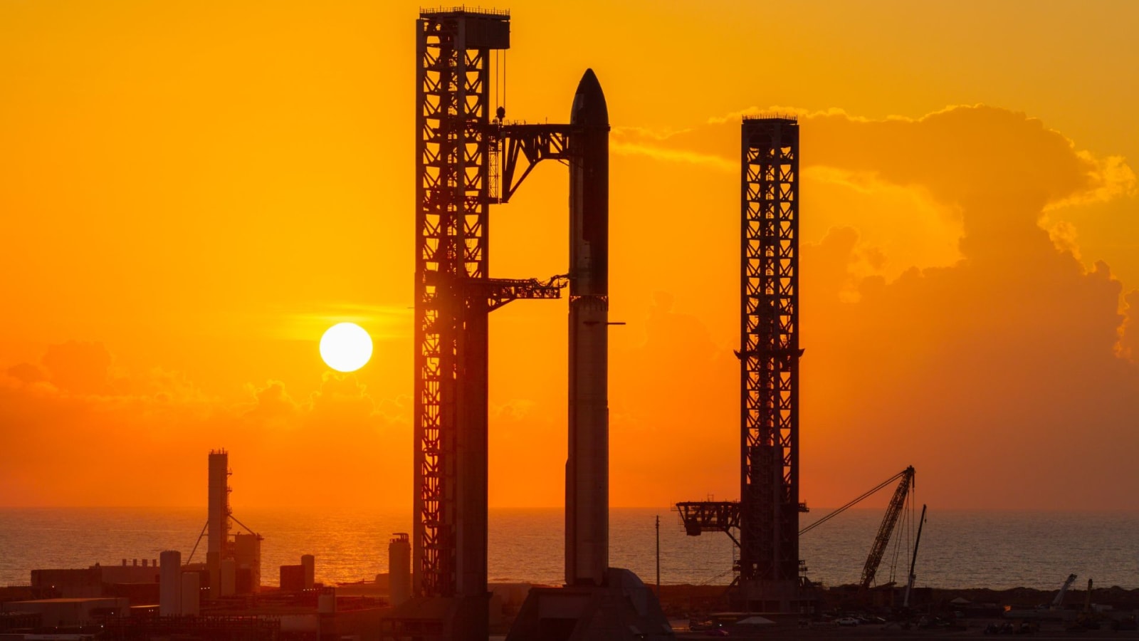 Starship photographed during sunrise at the launch pad in Starbase, Texas, ahead of its debut orbital flight.
