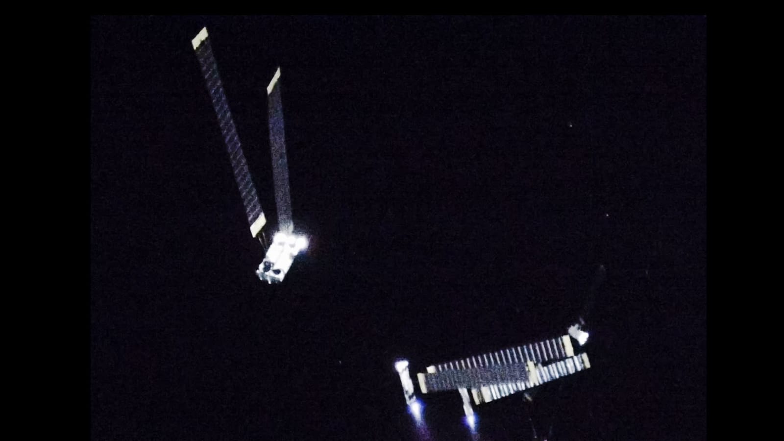 Starlink V3 satellites firing their thrusters during deployment in low-Earth orbit on Starship's test flight, July 24, 2026.