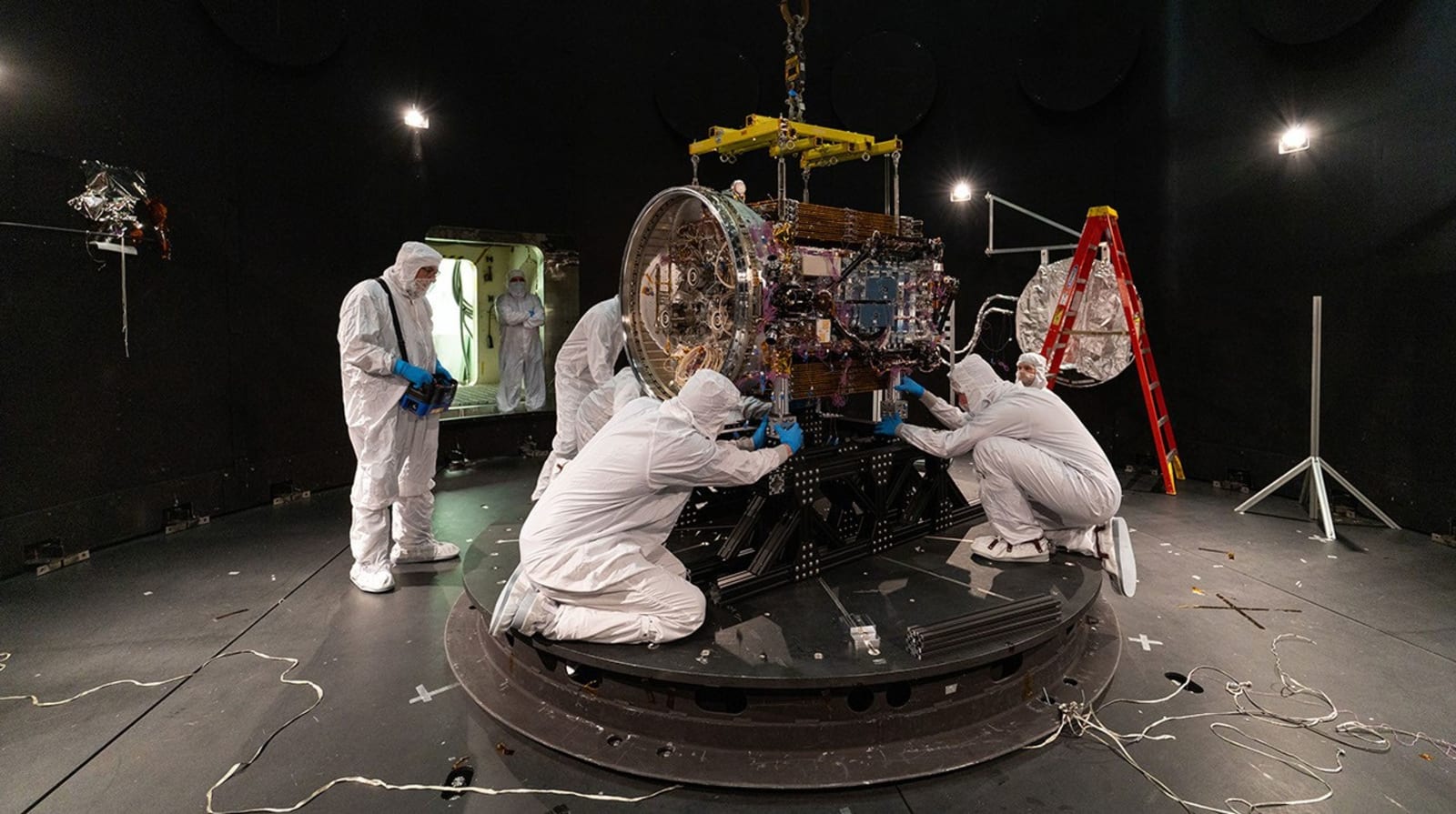 Katalyst engineers attach the LINK robotic servicing spacecraft to a baseplate inside the Space Environment Simulator at NASA’s Goddard Space Flight Center in Greenbelt, Maryland, on April 28, 2026.  (Image Source: NASA/Sophia Roberts)
