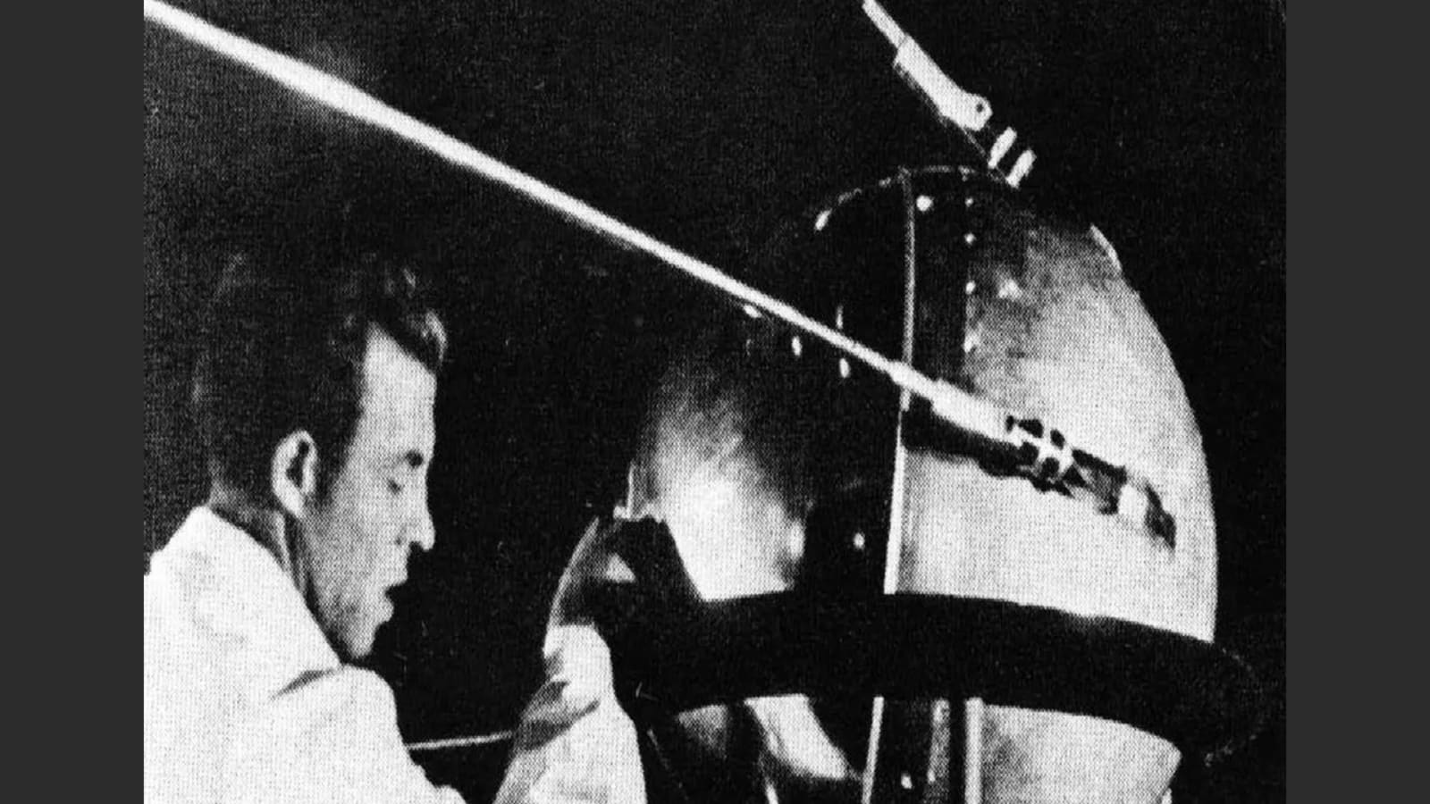 A technician putting the finishing touches on Sputnik 1, humanity’s first artificial satellite.