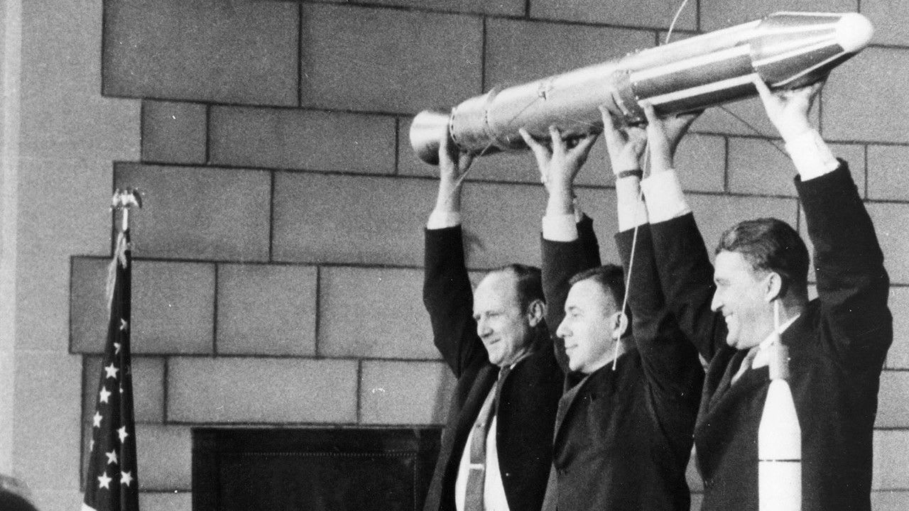 The Explorer team, with a model of the Explorer 1 satellite. (Image Source: NASA)