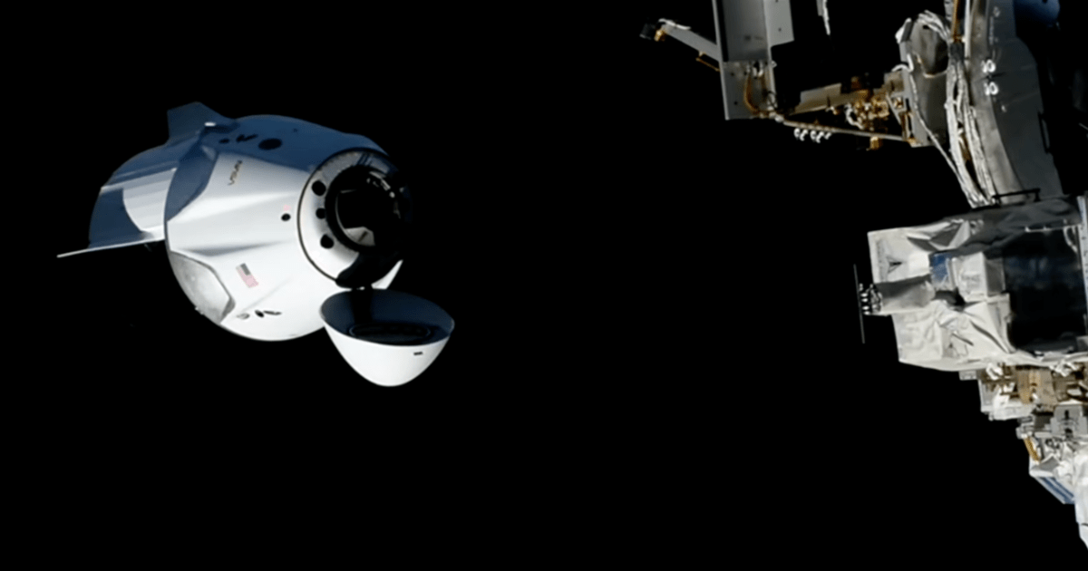 The SpaceX Dragon, with its nose cone open and carrying four Crew-13 members, approaches the International Space Station for a docking. (Image Source: NASA)